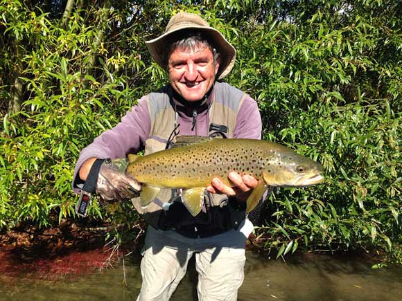 Another beautiful trout landed with New Zealand bi-lingual fishing guide Alan Campbell