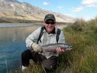 Releasing a trout.