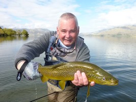 Trout hooked by anglers fly fishing in the lakes and rivers at the foot of the Southern Alps in New Zealand.