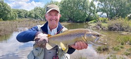 Fly fishing trout in beautiful New Zealand